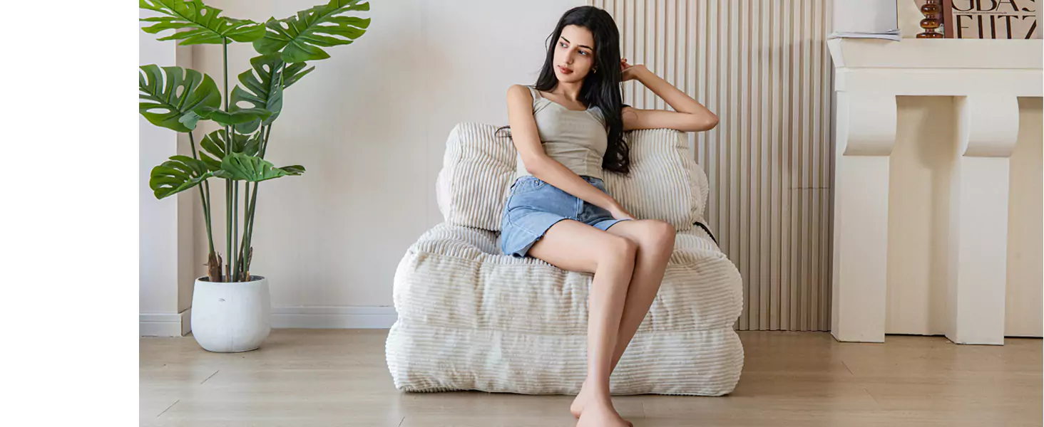 Foldable Furniture for Small Spaces on Amazon in 2025 - A girl is siting on MAXYOYO Folding Sofa Bed