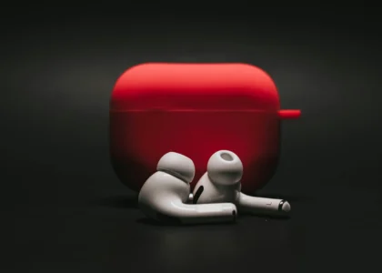 AI-powered translation earbuds real-time - An image of earbuds with black background in cinematic shot