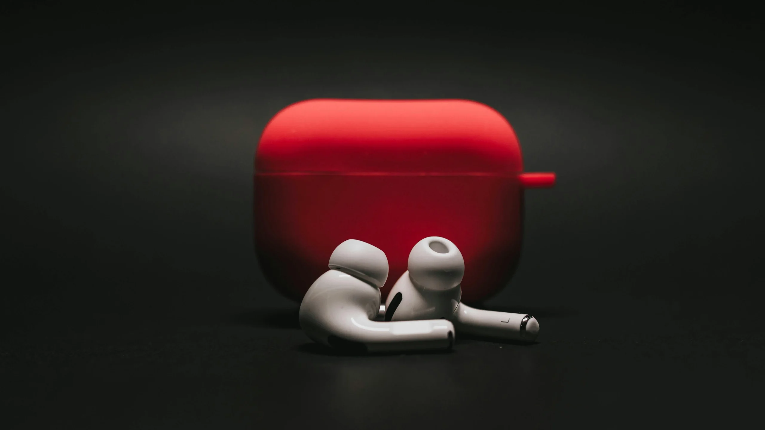 AI-powered translation earbuds real-time - An image of earbuds with black background in cinematic shot